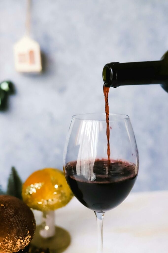 Pouring a glass of red wine