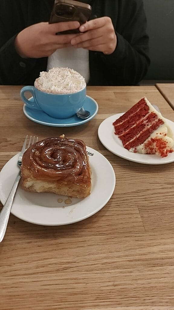 cinnamon roll, cake, hot chocolate