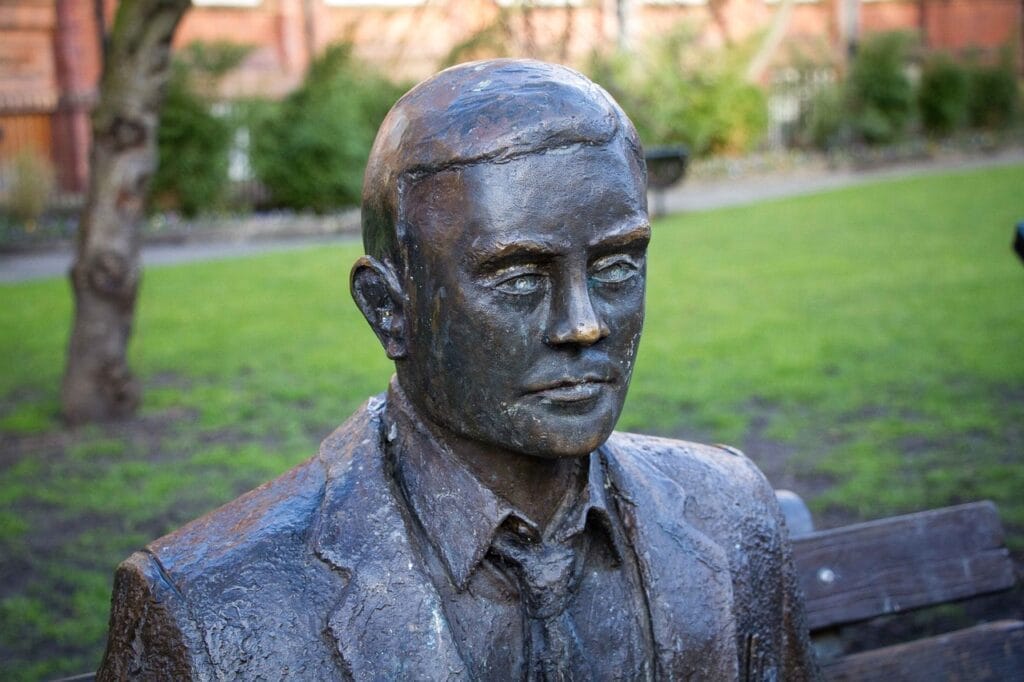 statue of Alan Turing on bench